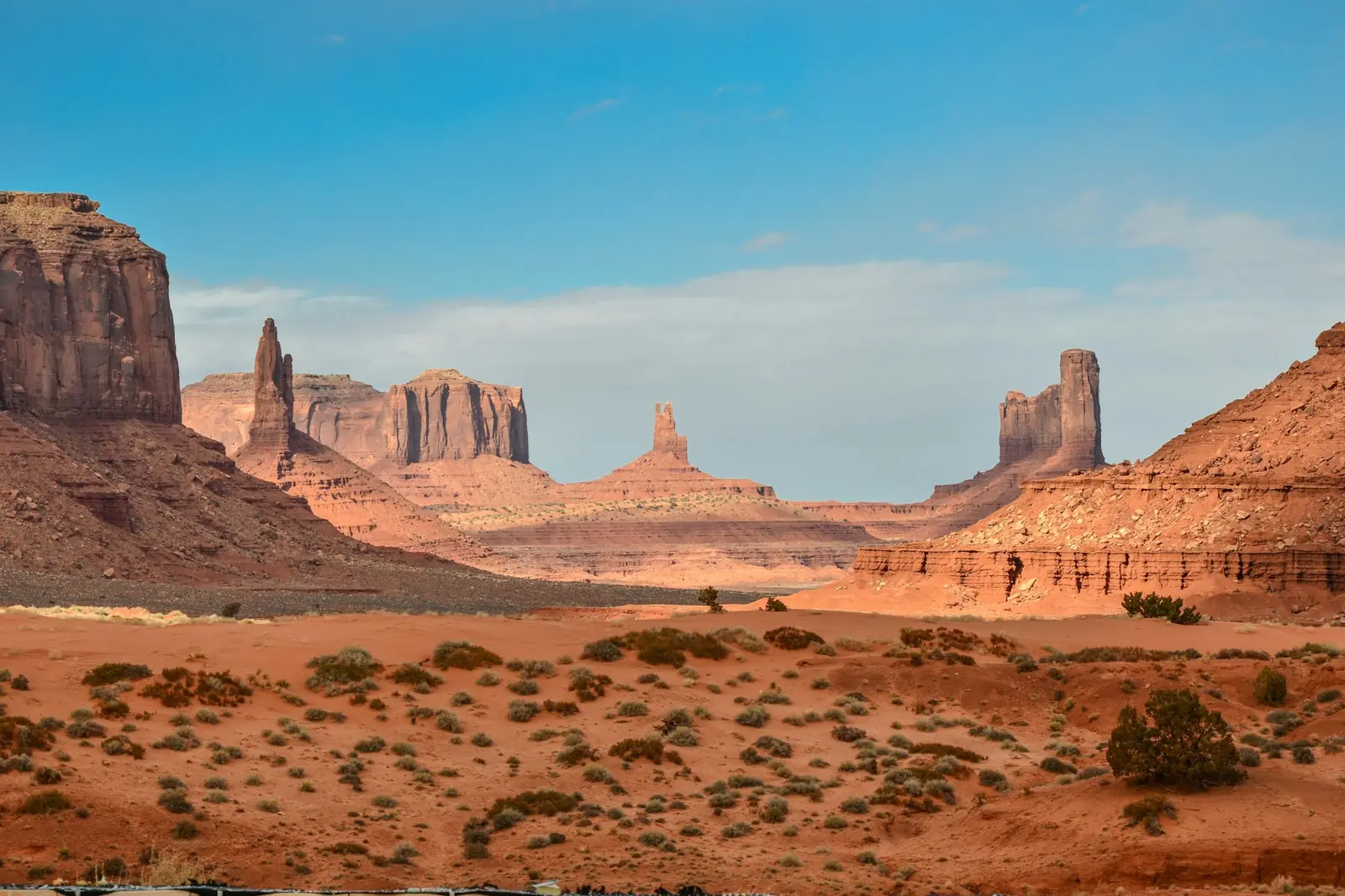 Rolling sand dunes under a clear sky
