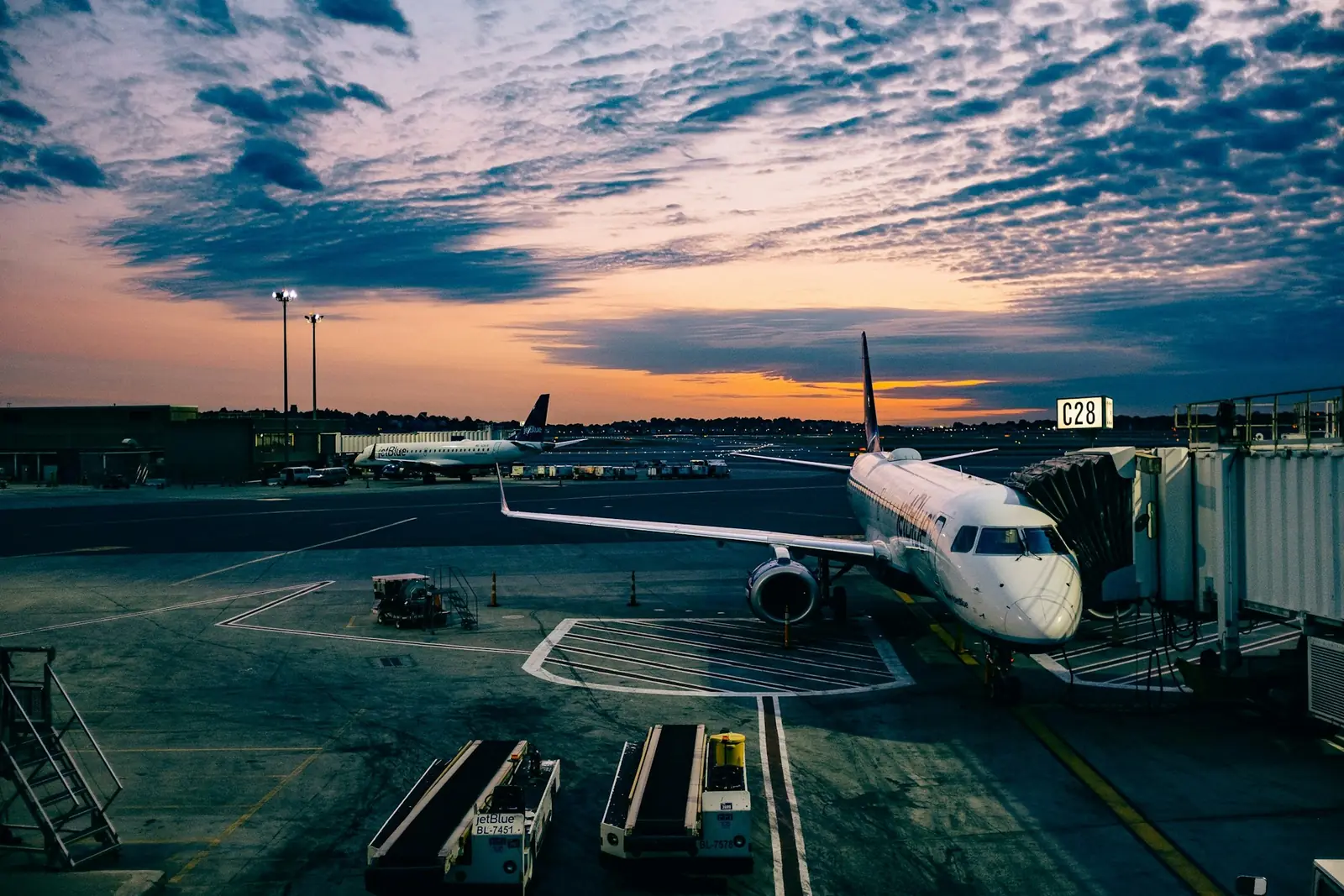 Travellers in a bright airport concourse